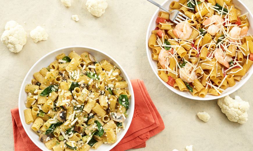 A variety of Noodles & Company pasta dishes including Cauliflower Rigatoni