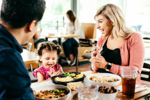 Image of family eating together at table